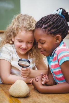 girl with magnifying glass