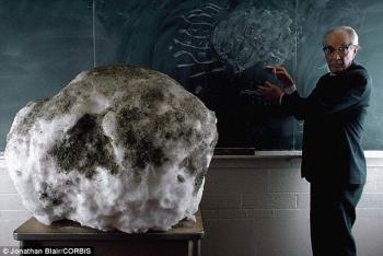 man with a giant dirty snowball