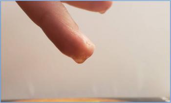 water droplets on fingertip
