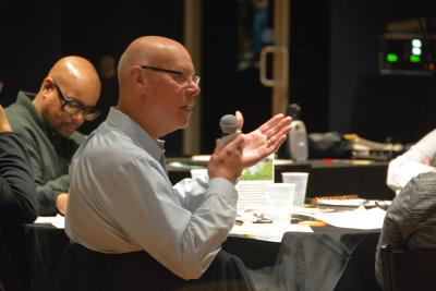 man talking into microphone