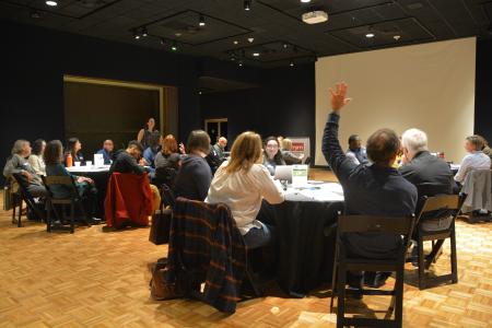 group of people sitting at round tables