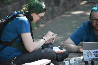 people doing research on a deck