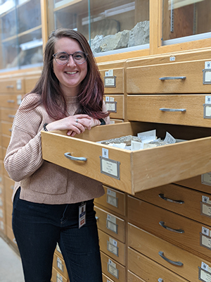 katie pauls standing next to drawers