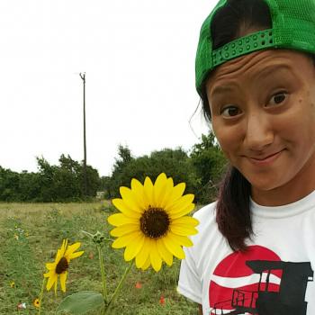 woman holding sunflower