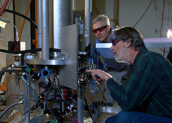 Physicists Steve Jefferts and Tom Heavner with Cesium Atomic Clock