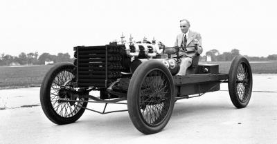 henry ford sitting in early car