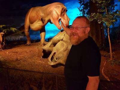 man being eaten by dinosaur